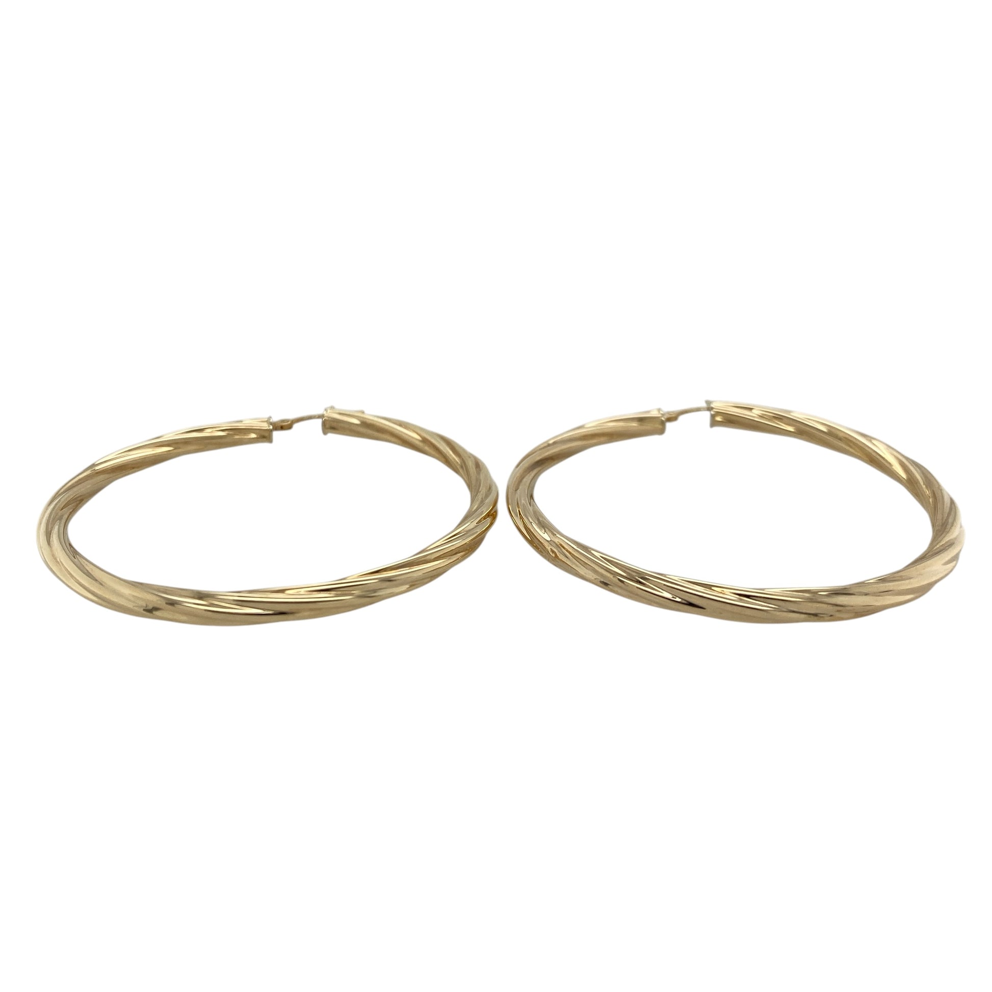 This pair of pre-owned 9ct yellow gold large twisted hoop creole earrings combines a bold size with a timeless twisted design.

Design: Featuring an elegant twisted finish, these large hoop creole earrings catch the light beautifully while adding texture and character. With an impressive 55mm diameter, they make a stylish statement while remaining versatile enough for both everyday wear and special occasions.
Material: Made from 9-carat yellow gold.