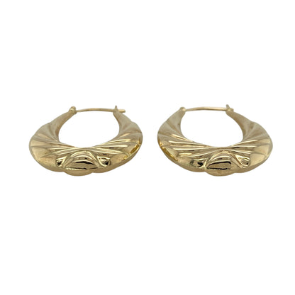 This pair of pre-owned 9ct yellow gold patterned oval creole earrings offers a timeless design enhanced with decorative detailing.

Design: These elegant oval creole earrings feature an attractive patterned finish that adds texture and character to the classic hoop design. Their versatile style makes them suitable for everyday wear as well as special occasions.
Material: Made from 9-carat yellow gold.
Earring Detail: Patterned oval creole earrings with secure hinged fastenings.