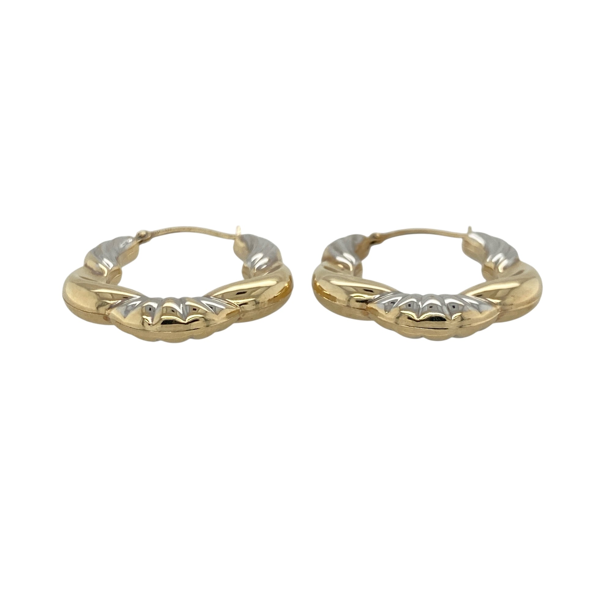 This pair of pre-owned 9ct yellow and white gold patterned twisted hoop creole earrings combines two-tone gold with an elegant twisted design.

Design: These eye-catching hoop creole earrings feature intertwined yellow and white gold with a decorative patterned finish, creating a striking two-tone look. Their 25mm diameter offers a versatile size that is ideal for both everyday wear and special occasions.
Material: Made from 9-carat yellow and white gold.