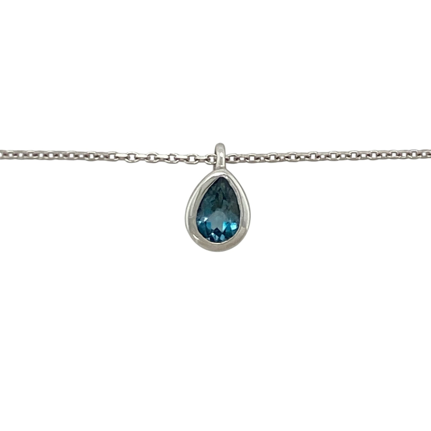 This pre-owned 14ct white gold blue topaz teardrop pendant necklace offers timeless elegance with the versatility of an adjustable chain.

Design: Suspended from an adjustable 16 to 18-inch trace chain, the graceful teardrop pendant showcases a beautiful blue topaz gemstone that adds a vibrant touch of colour. The adjustable length makes it easy to style with a variety of necklines, making it perfect for both everyday wear and special occasions.
Material: Made from 14-carat white gold.
