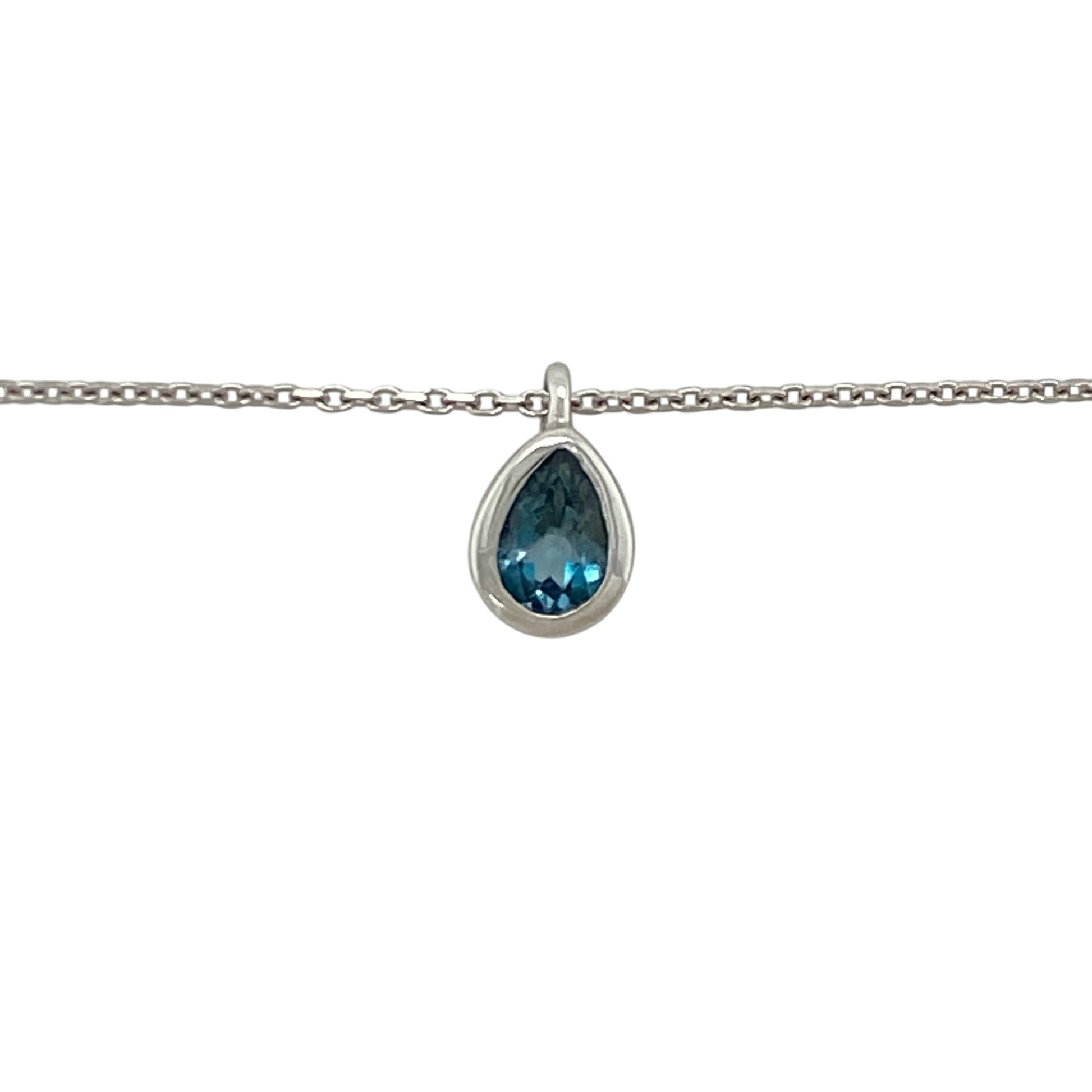 This pre-owned 14ct white gold blue topaz teardrop pendant necklace offers timeless elegance with the versatility of an adjustable chain.

Design: Suspended from an adjustable 16 to 18-inch trace chain, the graceful teardrop pendant showcases a beautiful blue topaz gemstone that adds a vibrant touch of colour. The adjustable length makes it easy to style with a variety of necklines, making it perfect for both everyday wear and special occasions.
Material: Made from 14-carat white gold.
