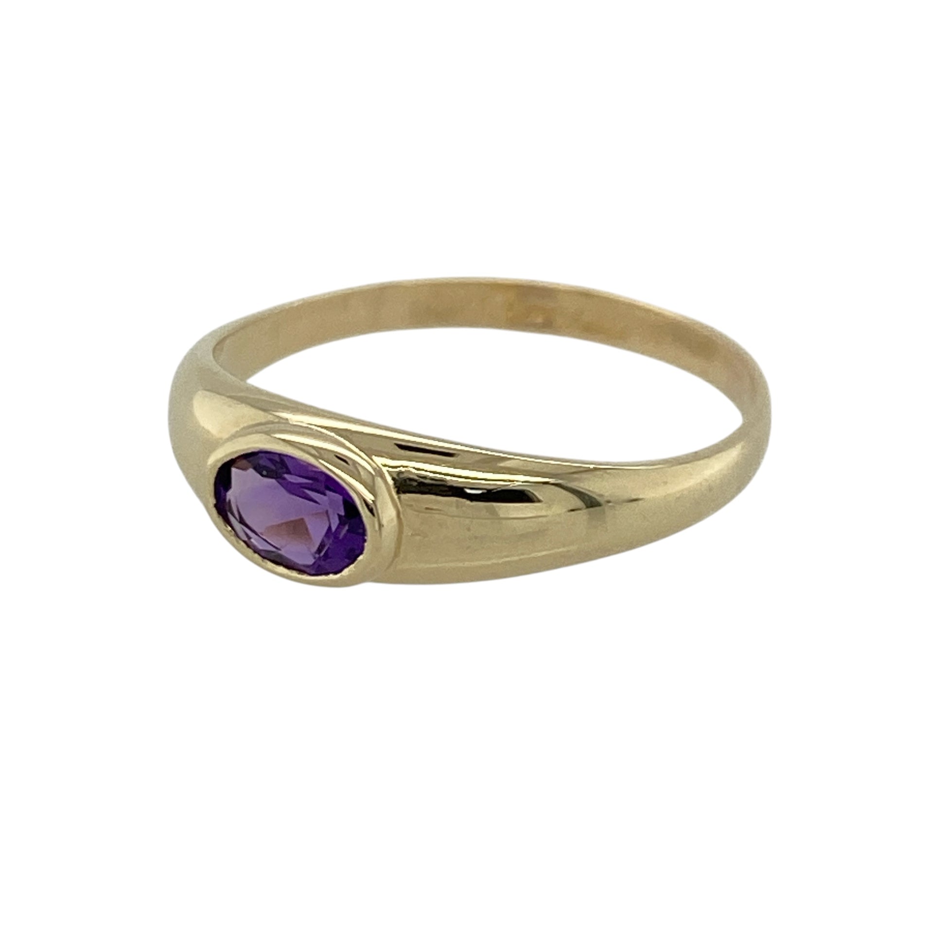 This pre-owned 9ct yellow gold amethyst band ring showcases a vibrant oval amethyst in a timeless and elegant design.

Design: The ring features a beautiful oval-cut amethyst in a classic band setting, allowing the rich purple gemstone to take centre stage. Its simple yet elegant style makes it ideal for both everyday wear and special occasions.
Material: Made from 9-carat yellow gold.
Gemstone Detail: Set with an oval amethyst measuring approximately 6mm by 4mm.