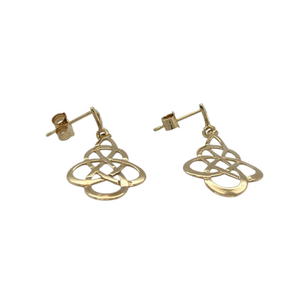 This pair of pre-owned 9ct yellow gold Celtic knot drop earrings showcases a timeless design inspired by traditional Celtic symbolism.

Design: Featuring elegant Celtic knot drops, these earrings represent eternity and interconnectedness through their intricate openwork design. Their lightweight construction makes them comfortable for everyday wear while adding a meaningful touch to any outfit.
Material: Made from 9-carat yellow gold.
Earring Detail: Celtic knot drop earrings with secure hook fastenings.