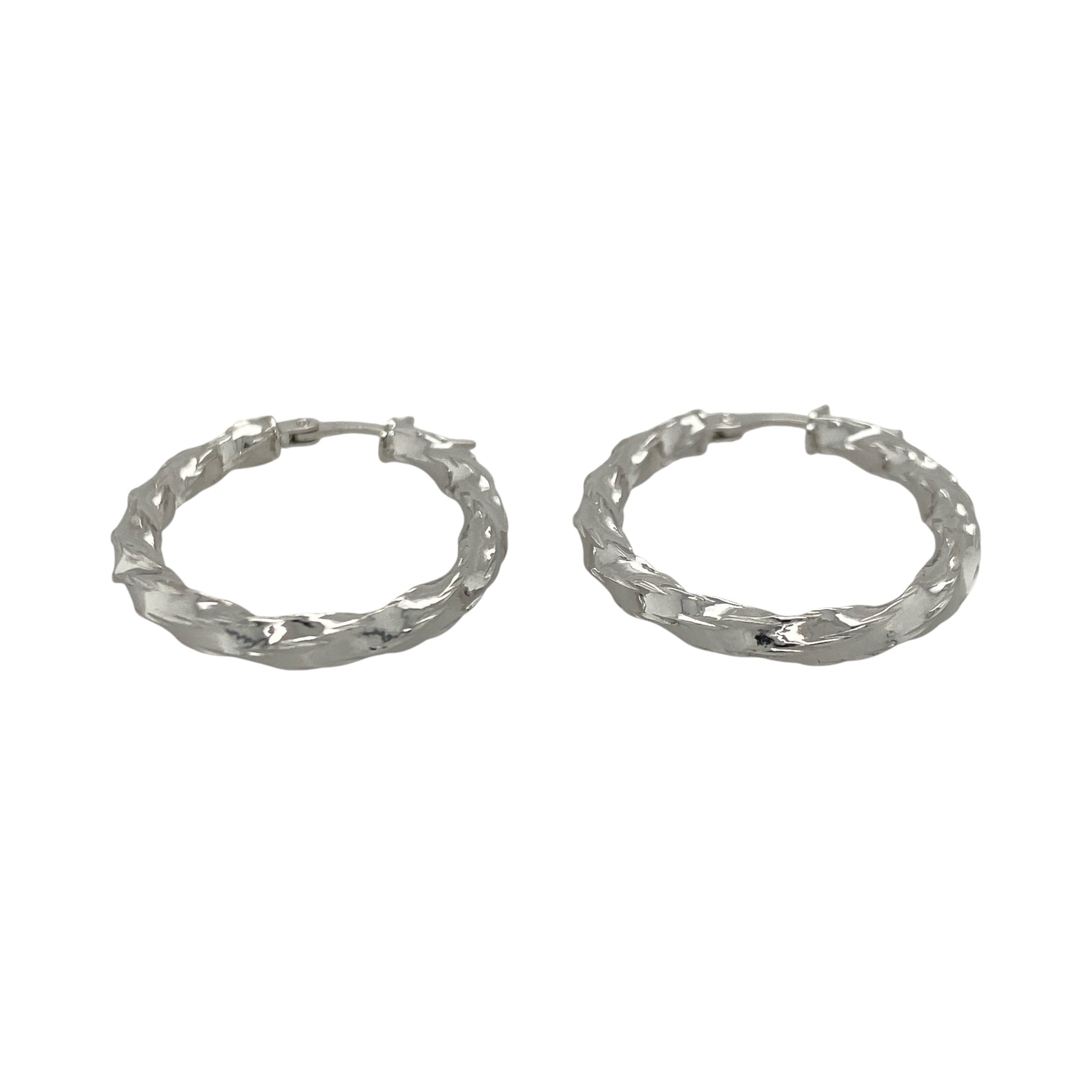 This pair of pre-owned 9ct white gold twisted oval creole earrings offers a stylish twist on a timeless jewellery classic.

Design: Featuring an elegant oval hoop shape with a twisted finish, these creole earrings catch the light beautifully while adding subtle texture and interest. Their versatile design makes them ideal for everyday wear as well as special occasions.
Material: Made from 9-carat white gold.
Earring Detail: Twisted oval creole earrings with secure hinged fastenings.