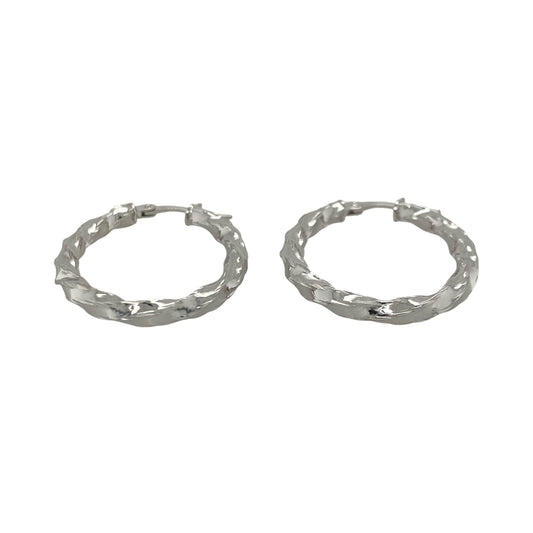 This pair of pre-owned 9ct white gold twisted oval creole earrings offers a stylish twist on a timeless jewellery classic.

Design: Featuring an elegant oval hoop shape with a twisted finish, these creole earrings catch the light beautifully while adding subtle texture and interest. Their versatile design makes them ideal for everyday wear as well as special occasions.
Material: Made from 9-carat white gold.
Earring Detail: Twisted oval creole earrings with secure hinged fastenings.