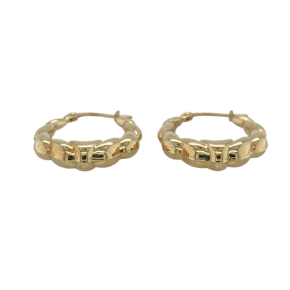 This pair of pre-owned 9ct yellow gold twisted bubble style oval creole earrings offers a distinctive take on a classic hoop design.

Design: Featuring an elegant oval creole shape with a twisted bubble style finish, these earrings combine polished curves with textured detailing to create a contemporary yet timeless look. Their versatile design makes them ideal for both everyday wear and special occasions.
Material: Made from 9-carat yellow gold.