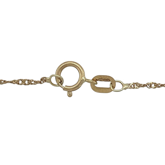 This pre-owned 9ct yellow gold Singapore chain is a delicate and elegant necklace, perfect for everyday wear.

Design: Featuring the distinctive twisted Singapore link design, this 20-inch chain catches the light beautifully with its subtle shimmer. Its fine 1mm links create a refined look, making it ideal for wearing alone for a minimalist style or paired with a favourite pendant.
Material: Made from 9-carat yellow gold.