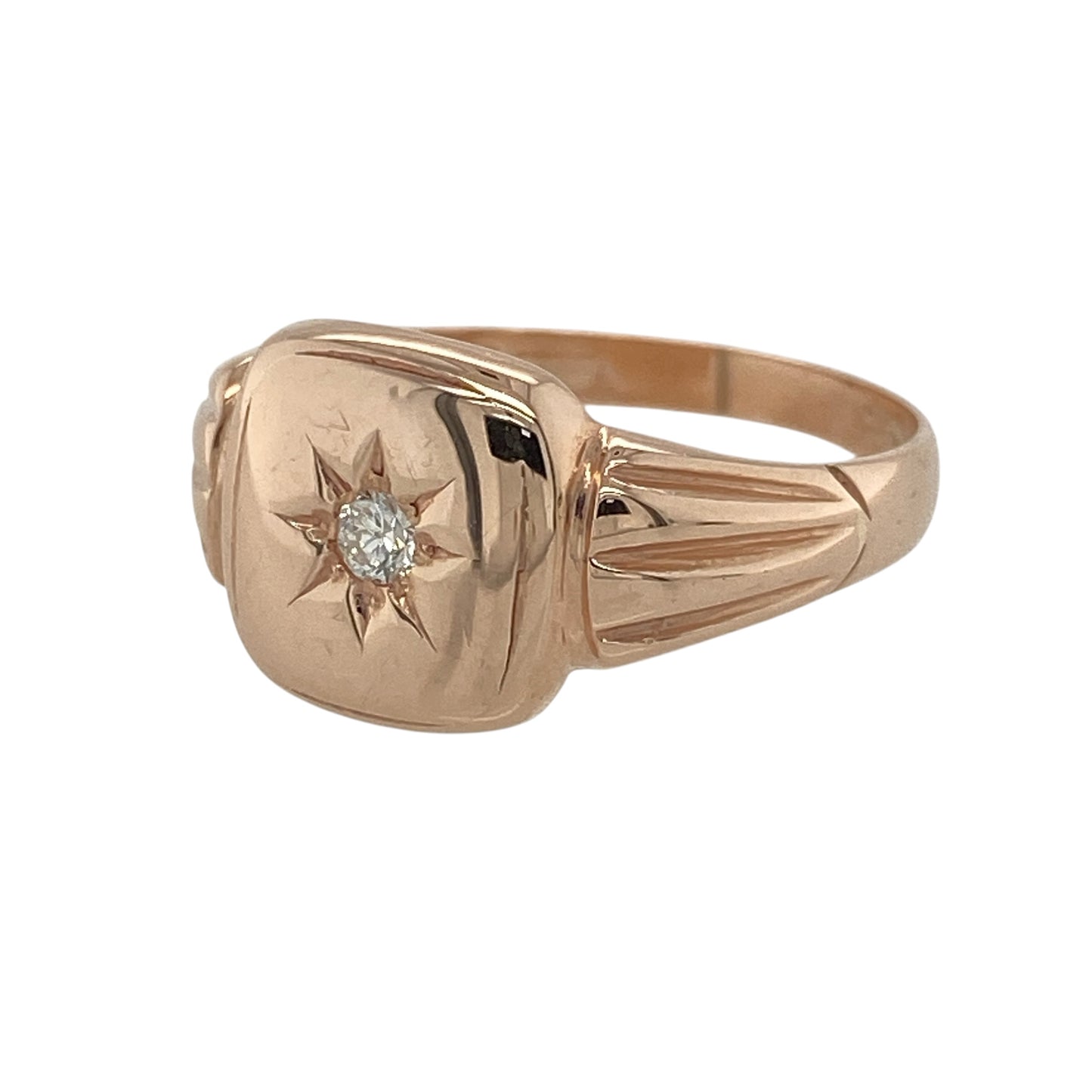 This pre-owned 9ct rose gold diamond signet ring is a timeless piece, combining classic styling with a subtle touch of sparkle.

Design: Featuring a polished signet face measuring approximately 10mm high, this elegant ring is centred with an approximate 0.05ct brilliant cut diamond in a striking starburst setting. The warm rose gold and understated design make it perfect for everyday wear while adding a refined finish.
Material: Made from 9-carat rose gold.