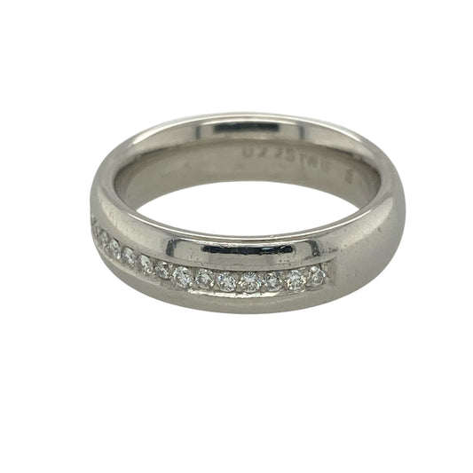 This pre-owned platinum diamond band ring is a substantial and timeless piece, combining the enduring strength of platinum with elegant diamond sparkle.

Design: Featuring a polished 5mm wide platinum band, this ring is set with a single row of sparkling diamonds running across the centre of half the band. With an approximate total diamond weight of 0.25ct, the clean and sophisticated design makes it ideal as a wedding band, anniversary ring or everyday piece.
Material: Made from platinum.