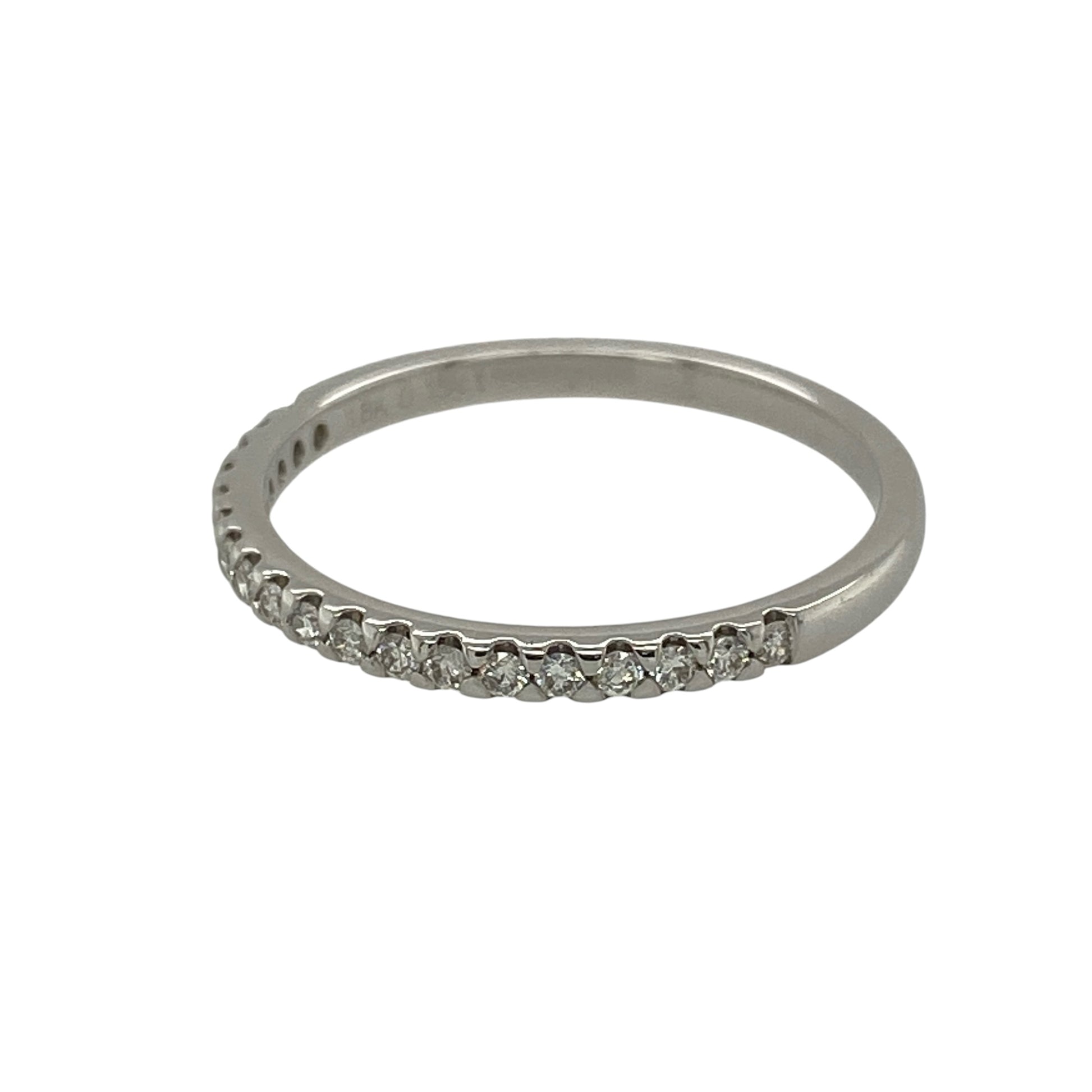 This pre-owned 18ct white gold diamond band ring is a timeless and elegant piece, offering classic style with understated sparkle.

Design: Featuring a slim 2mm wide band, this elegant ring is set with sparkling diamonds totalling approximately 0.15ct. Its refined profile makes it perfect for everyday wear, stacking with other rings or as a wedding or anniversary band.
Material: Made from 18-carat white gold.
Gemstone Detail: Set with diamonds with an approximate total diamond weight of 0.15ct.