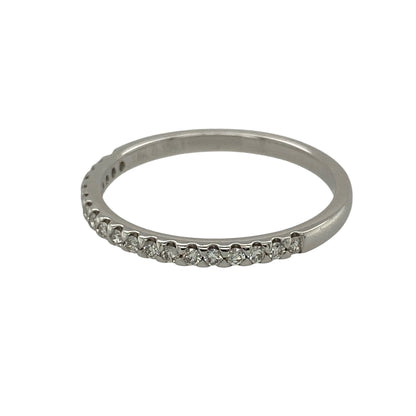 This pre-owned 18ct white gold diamond band ring is a timeless and elegant piece, offering classic style with understated sparkle.

Design: Featuring a slim 2mm wide band, this elegant ring is set with sparkling diamonds totalling approximately 0.15ct. Its refined profile makes it perfect for everyday wear, stacking with other rings or as a wedding or anniversary band.
Material: Made from 18-carat white gold.
Gemstone Detail: Set with diamonds with an approximate total diamond weight of 0.15ct.