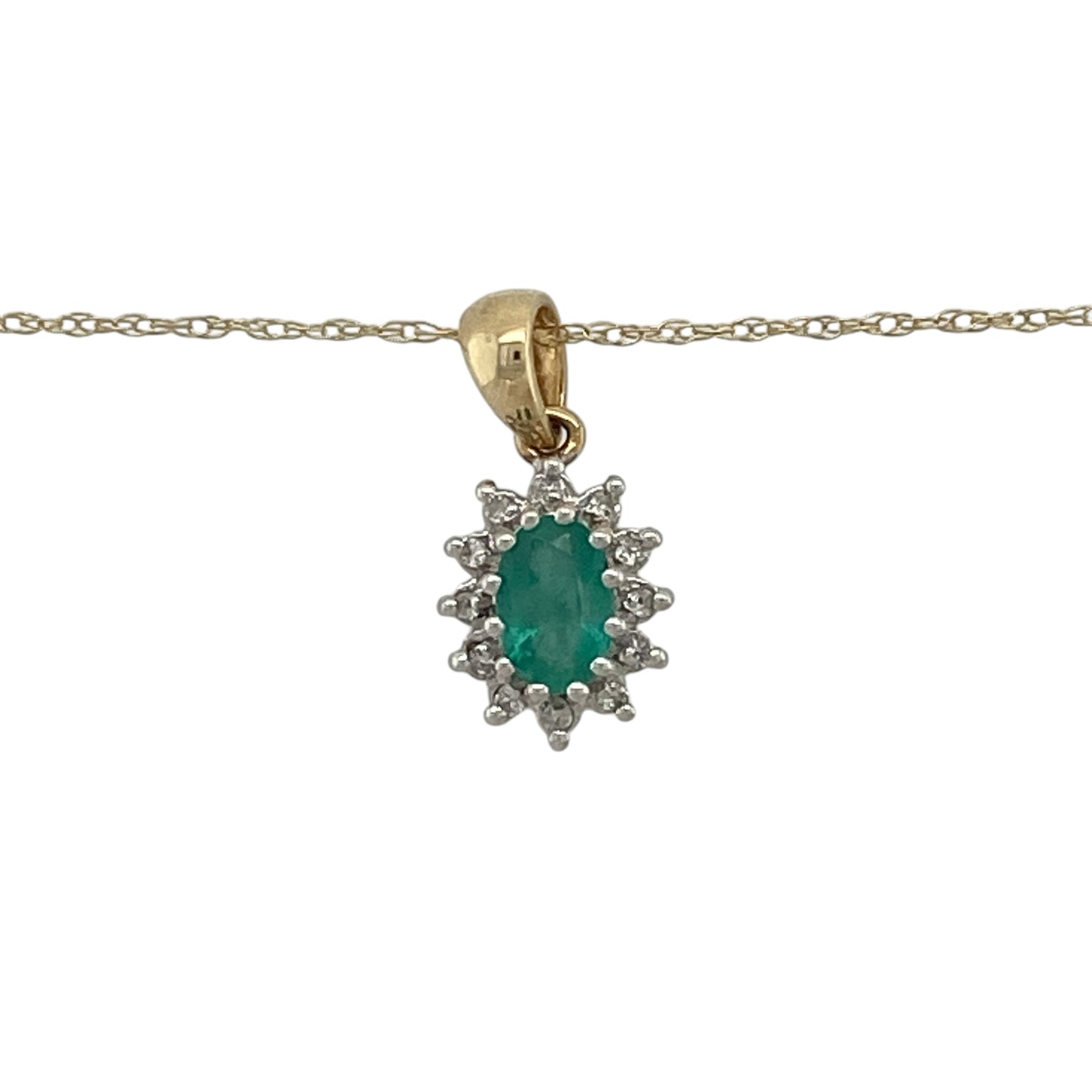 This pre-owned 9ct yellow gold diamond and emerald cluster pendant necklace is a timeless piece, combining the rich green beauty of emerald with sparkling diamond accents.

Design: Featuring an elegant oval emerald at the centre, surrounded by a halo of sparkling diamonds, this classic cluster pendant is suspended from a 19-inch Prince of Wales chain. The pendant measures approximately 1.6cm long including the bail