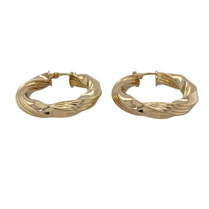 This pair of pre-owned 9ct yellow gold twisted hoop creole earrings offers timeless style with a bold and elegant finish.

Design: Featuring a classic twisted hoop design, these polished creole earrings catch the light beautifully, creating extra texture and sparkle. Measuring approximately 30mm in diameter, they offer a striking yet versatile look that is perfect for everyday wear or dressing up for special occasions.
Material: Made from 9-carat yellow gold.
Size & Weight: Hoop diameter approximately 30mm.