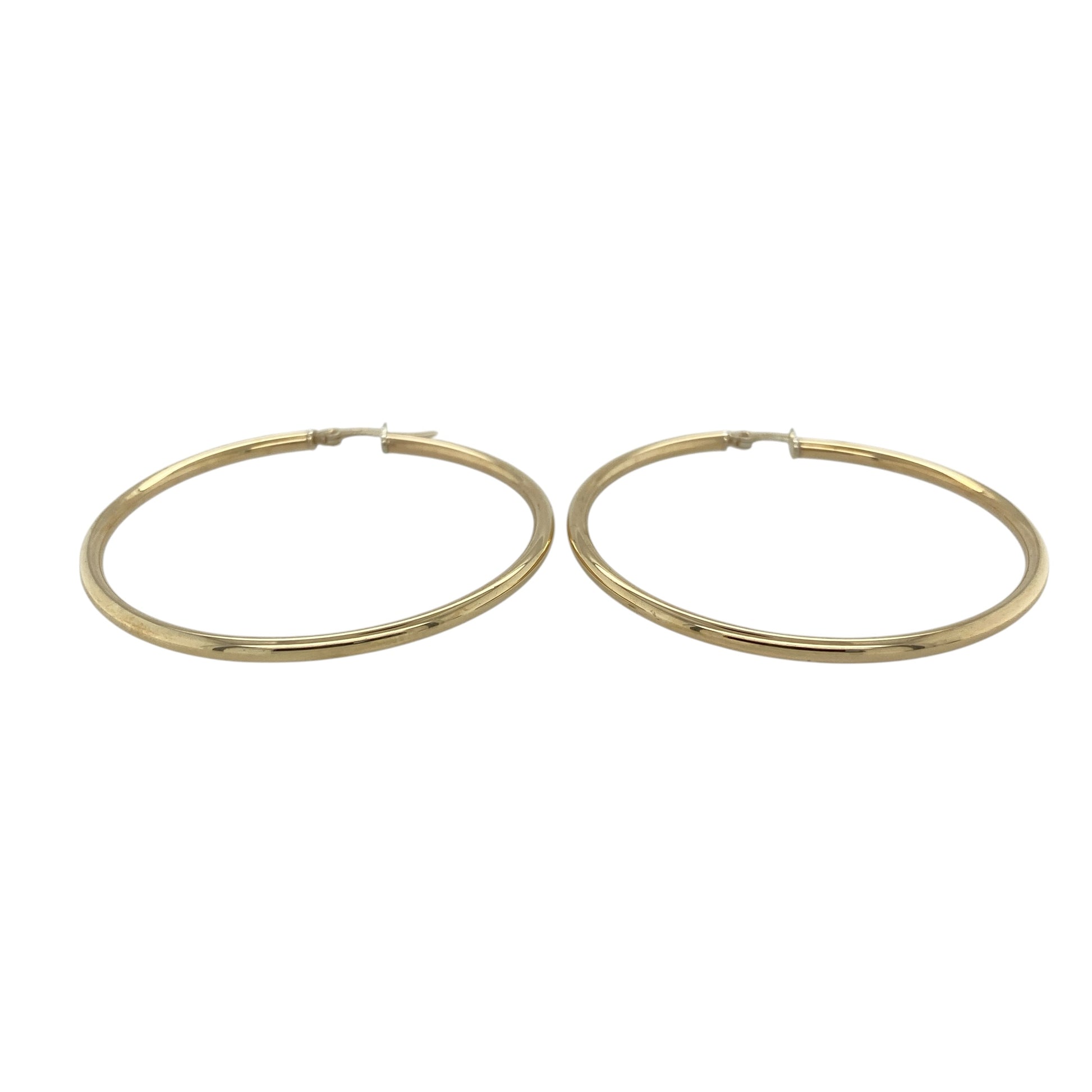 This pair of pre-owned 9ct yellow gold large plain hoop creole earrings is a timeless jewellery staple with a bold, eye-catching look.

Design: Featuring a classic plain polished hoop design, these large creole earrings offer effortless style that never goes out of fashion. Measuring approximately 49mm in diameter, they create a striking statement while remaining versatile enough to complement both everyday and occasion wear.
Material: Made from 9-carat yellow gold.