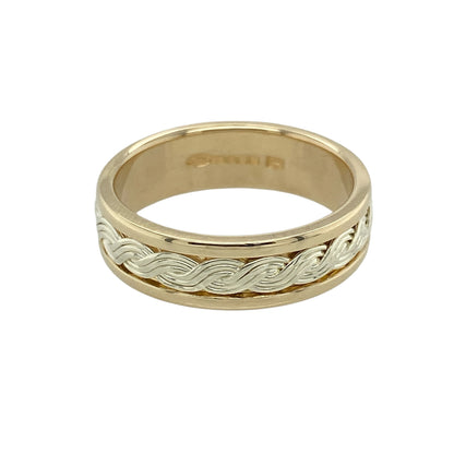 This pre-owned 9ct yellow and white Welsh Gold Cymru metal twisted band ring beautifully combines traditional Welsh heritage with a timeless contemporary design.

Design: Featuring an elegant twisted band crafted from contrasting yellow and white gold, this striking ring celebrates Welsh craftsmanship with its distinctive Cymru metal design. Measuring approximately 6mm wide, it offers a bold yet comfortable fit, making it perfect for everyday wear or as a meaningful wedding or dress ring.