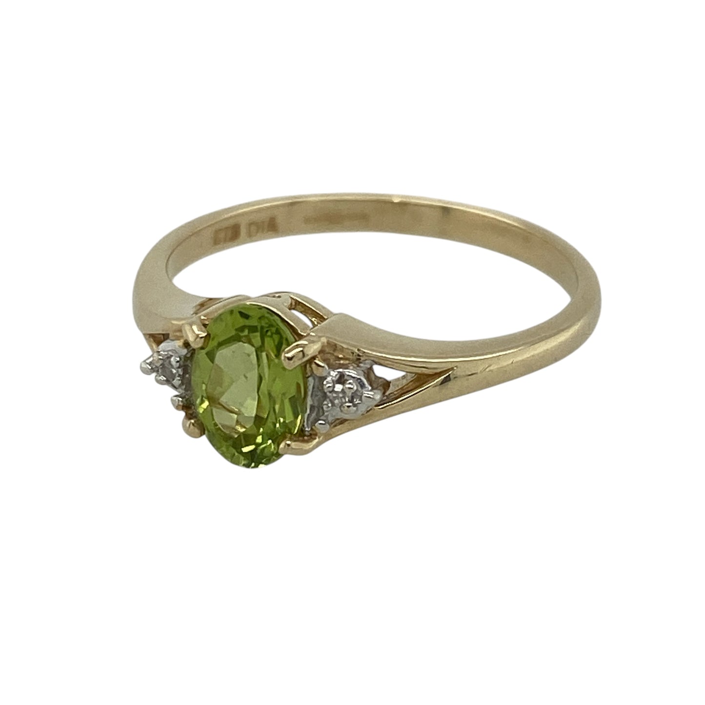 This pre-owned 9ct yellow gold diamond and peridot ring is a timeless design, showcasing the fresh green beauty of natural peridot with sparkling diamond accents.

Design: Featuring a vibrant oval peridot at its centre, this elegant ring is enhanced by a small diamond set on either side, creating a classic three-stone style. The vivid green gemstone contrasts beautifully with the warm yellow gold, making it a perfect choice for both everyday wear and special occasions.