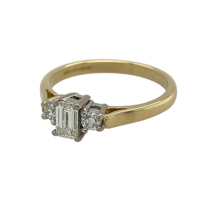 This pre-owned 18ct yellow gold diamond trilogy ring is a timeless and elegant design, combining classic styling with beautifully contrasting diamond cuts.

Design: Featuring a striking emerald cut diamond at its centre, complemented by a brilliant cut diamond on either side, this trilogy ring offers exceptional sparkle and sophistication.