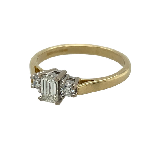 This pre-owned 18ct yellow gold diamond trilogy ring is a timeless and elegant design, combining classic styling with beautifully contrasting diamond cuts.

Design: Featuring a striking emerald cut diamond at its centre, complemented by a brilliant cut diamond on either side, this trilogy ring offers exceptional sparkle and sophistication.