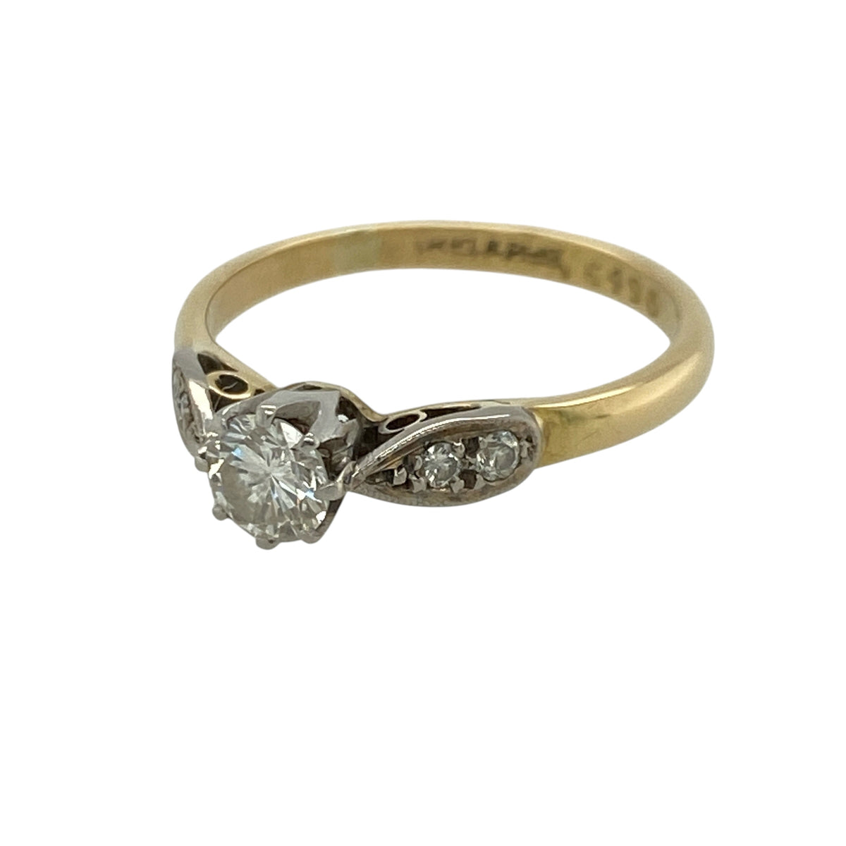 This pre-owned 18ct yellow gold and platinum diamond solitaire ring is a timeless design, beautifully showcasing a sparkling brilliant cut diamond in a classic two-tone setting.

Design: Featuring a stunning brilliant cut diamond in a platinum setting, this elegant solitaire ring combines the warmth of an 18-carat yellow gold band with the cool tones of platinum to enhance the diamond's brilliance.