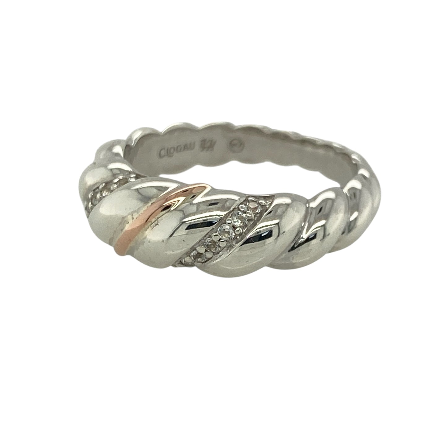 This pre-owned Clogau twist band ring is a beautiful sterling silver and 9ct rose gold design, finished with sparkling white topaz for an elegant two-tone look.

Design: Featuring a flowing twist band design, this Clogau ring combines polished sterling silver with signature 9ct rose gold detailing and sparkling white topaz stones. Measuring approximately 7mm wide across the front, the intertwined design creates a distinctive piece inspired by Welsh heritage.