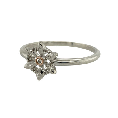 This pre-owned Clogau flower ring is a beautiful sterling silver and 9ct rose gold design, finished with sparkling white topaz and delicate floral detailing.

Design: Featuring an elegant flower design with signature 9ct rose gold detailing, this Clogau ring is enhanced by sparkling white topaz stones for a timeless finish. The front of the ring measures approximately 10mm high, creating a pretty floral design that beautifully combines sterling silver with warm rose gold.