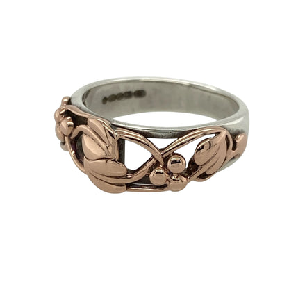 Bring meaningful elegance and heritage symbolism to your jewellery collection with this pre-owned 925 silver Clogau Tree of Life ring, featuring 9ct rose gold detailing—perfect for celebrating growth, connection, and timeless beauty.

Design: The ring features the iconic Tree of Life design across the front of the 8mm wide band, with flowing 9ct rose gold vines woven into the pattern for a graceful, layered effect.