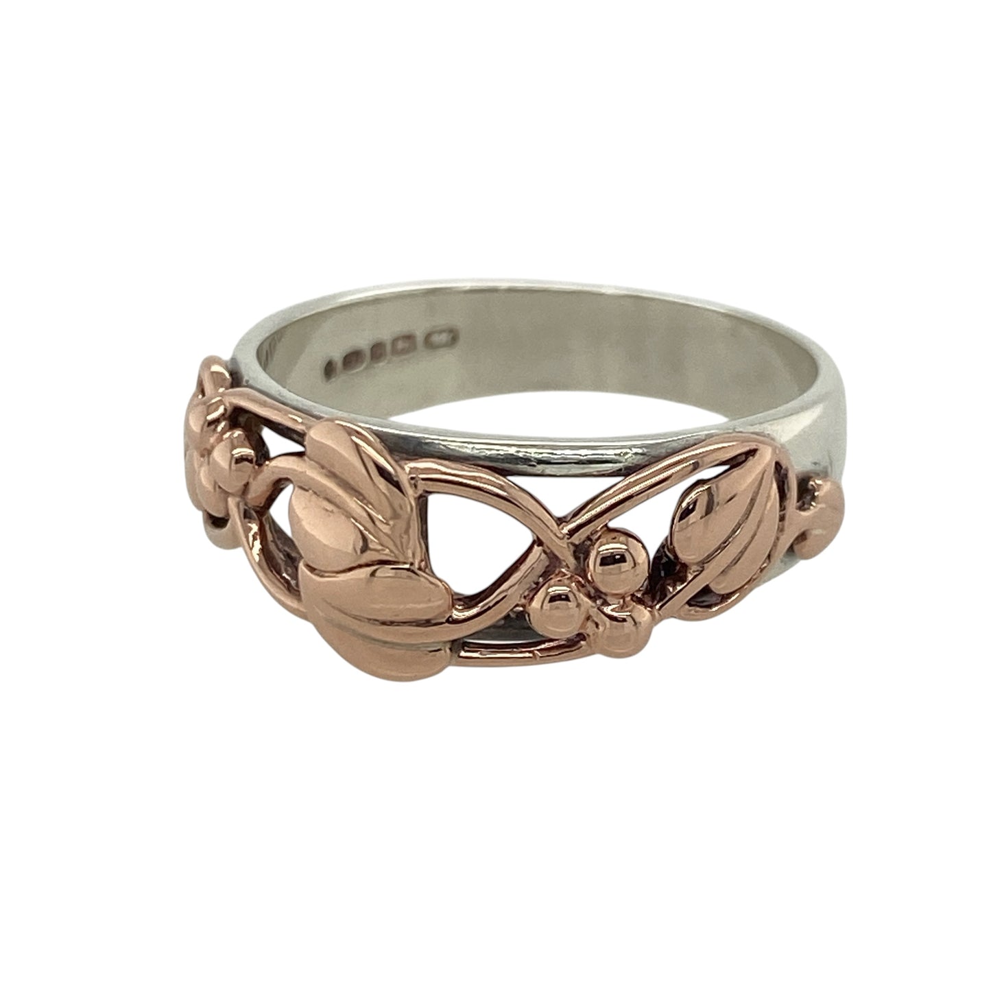 Bring meaningful elegance and heritage symbolism to your jewellery collection with this pre-owned 925 silver Clogau Tree of Life ring, featuring 9ct rose gold detailing—perfect for celebrating growth, connection, and timeless beauty.

Design: The ring features the iconic Tree of Life design across the front of the 8mm wide band, with flowing 9ct rose gold vines woven into the pattern for a graceful, layered effect.