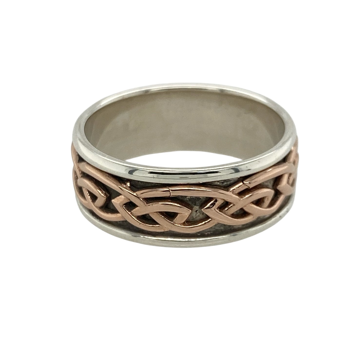 Bring rich symbolism and timeless elegance to your collection with this pre-owned 925 silver with 9ct rose gold Clogau Annwyl Celtic knot band ring, offering a bold design and meaningful presence—perfect for making a refined statement.

Design: The ring features an 8mm wide band adorned with an intricate Celtic knot pattern, symbolising eternal love and interconnectedness. The combination of silver and rose gold creates a striking contrast and a beautifully detailed look.