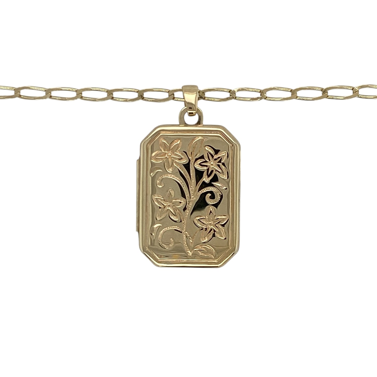 This pre-owned 9ct yellow gold flower patterned rectangle locket necklace is a classic design, combining delicate floral detailing with a timeless locket style.

Design: Featuring a rectangular locket decorated with an elegant flower pattern, this necklace offers a traditional design with decorative detail. The locket measures approximately 2.6cm long including the bail and is suspended from a 20-inch open curb chain.
Material: Made from 9-carat yellow gold.