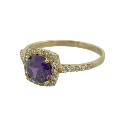 This pre-owned 9ct yellow gold amethyst and cubic zirconia halo ring is a colourful design, featuring a central round amethyst surrounded by cubic zirconias.

Design: Featuring a round amethyst at the centre surrounded by a halo of cubic zirconias, this ring combines rich purple tones with a classic yellow gold setting for an eye-catching finish.
Material: Made from 9-carat yellow gold.
Gemstone Detail: Round amethyst measuring approximately 5mm in diameter, surrounded by cubic zirconias.