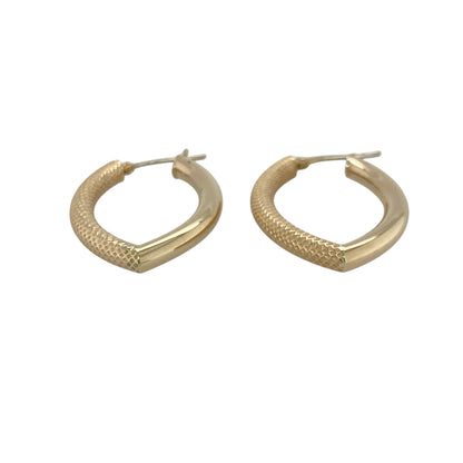 These pre-owned 9ct yellow gold marquise-shaped creole earrings are a distinctive design, combining a polished finish with textured detailing on one side.

Design: Featuring an elegant marquise-shaped creole design, these earrings have textured detailing on one side contrasted with a plain polished finish for added interest. Their unusual shape gives the classic gold creole a distinctive twist while remaining versatile for everyday wear.
Material: Made from 9-carat yellow gold.