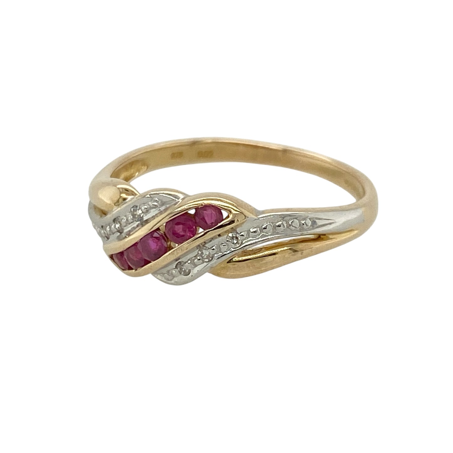 This pre-owned 9ct yellow and white gold diamond and ruby twist band ring is a colourful two-tone design, combining rich red rubies with delicate diamond detailing.

Design: Featuring a twist-style band set with diamonds and rubies, this ring combines yellow and white gold for a contrasting two-tone finish. The front of the band measures approximately 7mm wide, creating an eye-catching design with plenty of gemstone detail.
Material: Made from 9-carat yellow and white gold.
