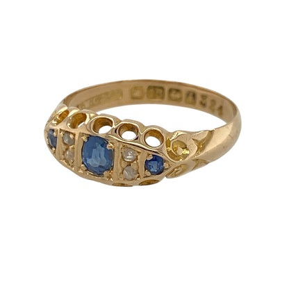 This pre-owned 18ct yellow gold diamond and sapphire vintage style boat ring is a traditional gemstone design, combining rich blue sapphire with classic diamond detailing.

Design: Featuring a vintage-inspired boat-shaped setting, this ring has a central sapphire accented by diamonds for a traditional and elegant finish. The warm 18ct yellow gold complements the deep blue tones of the sapphire beautifully.
Material: Made from 18-carat yellow gold.