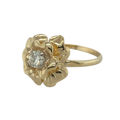 This pre-owned 9ct yellow gold diamond flower ring is a distinctive floral design, featuring a central diamond surrounded by yellow gold petal detailing.

Design: Featuring a flower-shaped design with a diamond set at the centre, this ring combines warm yellow gold with a classic floral motif for an eye-catching finish.
Material: Made from 9-carat yellow gold.
Gemstone Detail: Central diamond with approximately 0.25ct of diamond content.
Ring Detail: Flower-shaped design with the diamond set at the centre.