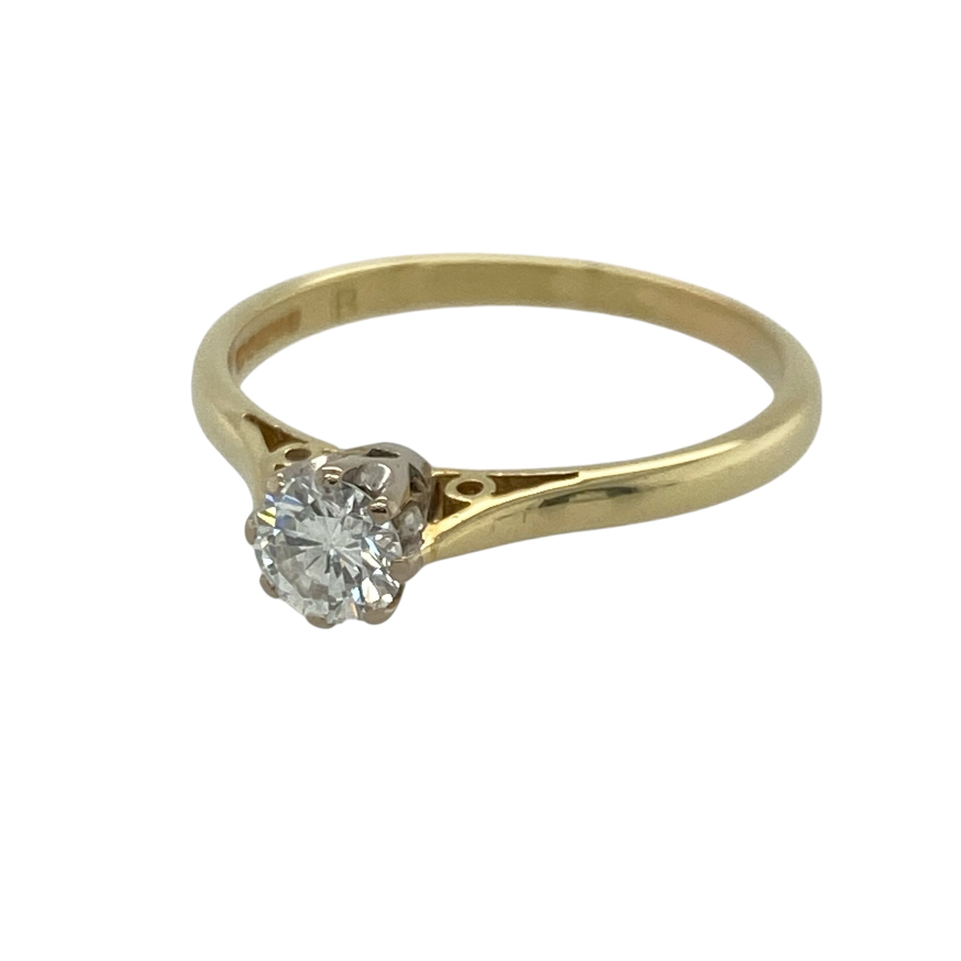 This pre-owned 18ct yellow gold diamond solitaire ring is a timeless design, featuring a brilliant cut diamond of approximately 0.44ct.

Design: Featuring a single brilliant cut diamond as the centrepiece, this solitaire ring combines a classic setting with warm 18ct yellow gold for an elegant and timeless look.
Material: Made from 18-carat yellow gold.
Gemstone Detail: Brilliant cut diamond measuring approximately 0.44ct.
Ring Detail: Classic diamond solitaire design.