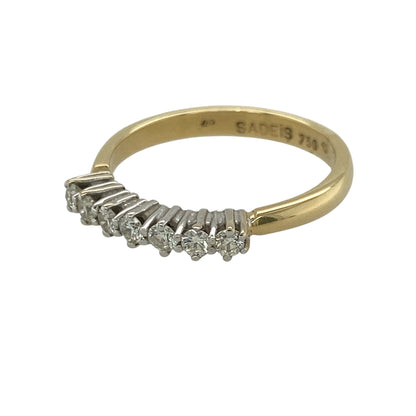 This pre-owned 18ct yellow gold diamond band ring is a classic seven stone design, featuring brilliant cut diamonds with approximately 0.25ct of diamond content in total.

Design: Featuring seven brilliant cut diamonds set across the front of the band, this ring combines a timeless diamond design with warm 18ct yellow gold.
Material: Made from 18-carat yellow gold.
Gemstone Detail: Seven brilliant cut diamonds with approximately 0.25ct of diamond content set in total.