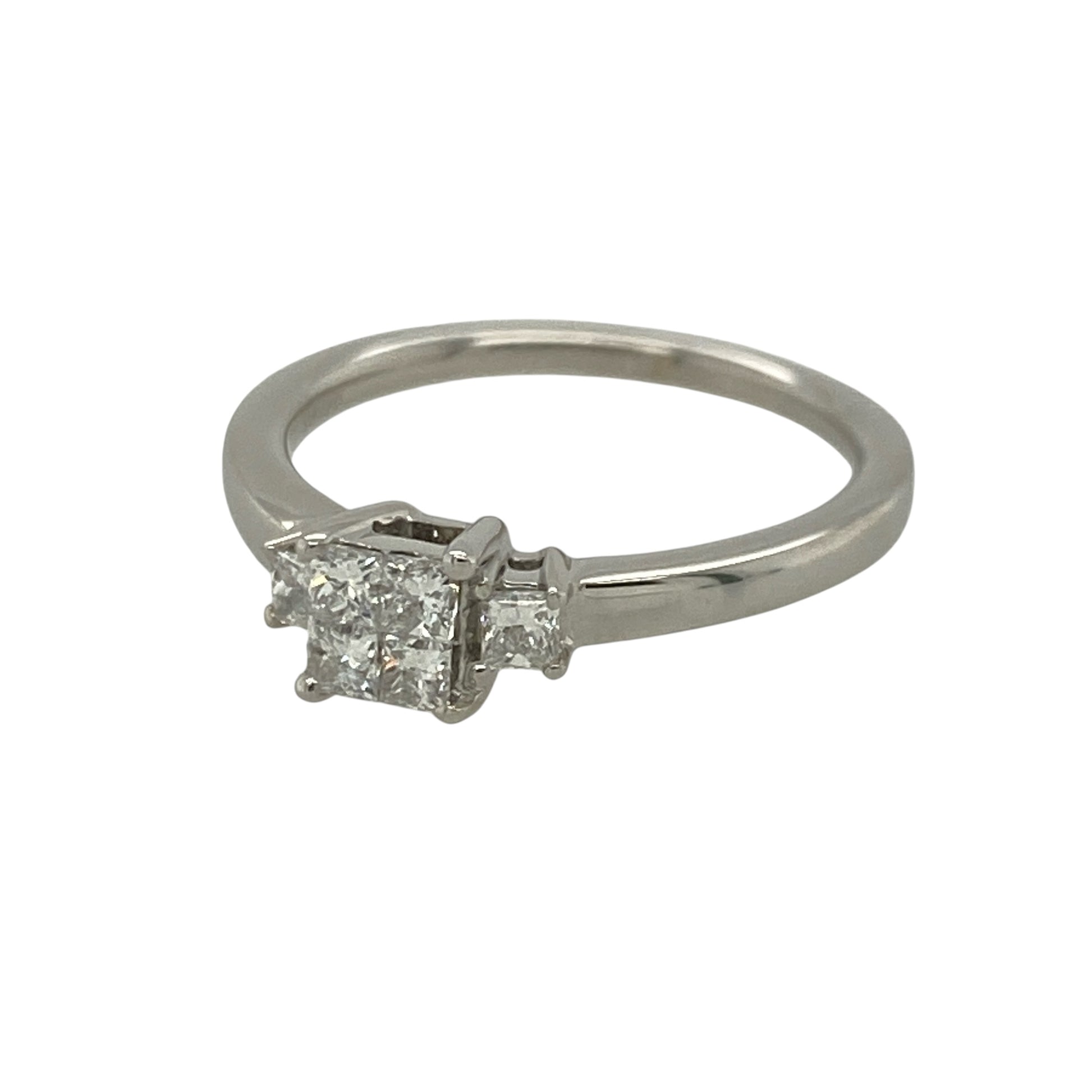 This pre-owned 9ct white gold diamond illusion trilogy ring is a distinctive design, featuring interlocking princess cut diamonds with approximately 0.36ct of diamond content in total.

Design: Featuring four interlocking princess cut diamonds arranged to create the appearance of a larger centre stone, with an additional diamond set on either side to form an illusion trilogy design. The white gold setting complements the geometric diamond arrangement for an eye-catching finish.