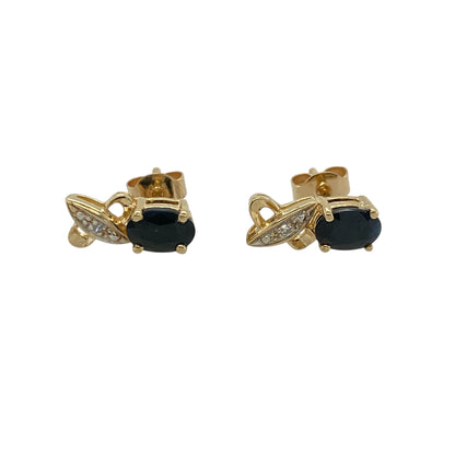 These pre-owned 9ct yellow gold diamond and sapphire stud earrings are a classic gemstone design, featuring oval sapphires accented with diamond detailing.

Design: Featuring an oval sapphire in each stud with diamond detailing, these earrings combine rich blue tones with warm 9ct yellow gold for a timeless look.
Material: Made from 9-carat yellow gold.
Gemstone Detail: Each earring features an oval sapphire measuring approximately 6mm by 4mm, accented with diamonds.