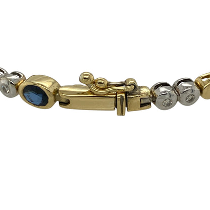 This pre-owned 18ct yellow and white gold diamond and sapphire bracelet is a substantial two-tone design, featuring five oval sapphires and twenty brilliant cut diamonds.

Design: Featuring five oval sapphires accented by twenty brilliant cut diamonds, this bracelet combines yellow and white gold for a classic two-tone finish. The alternating gemstone detailing creates an elegant design that can be worn for both everyday and special occasions.
Material: Made from 18-carat yellow and white gold.
