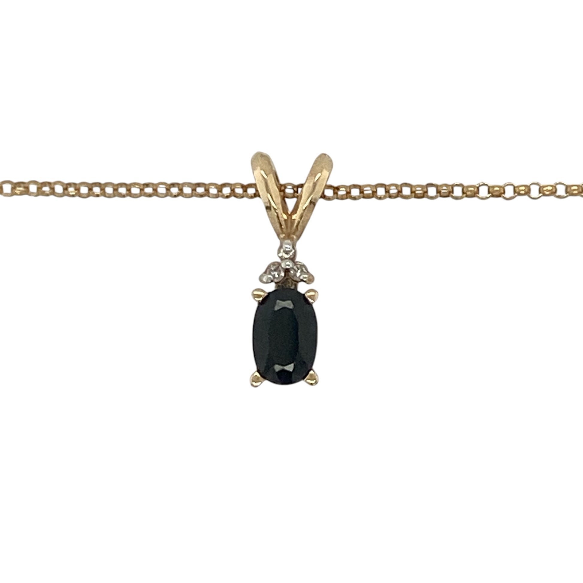 This pre-owned 9ct yellow gold diamond and sapphire pendant necklace is a classic gemstone design, featuring an oval sapphire accented with diamond detailing.

Design: Featuring an oval sapphire with diamond detailing, this pendant combines rich blue tones with warm 9ct yellow gold and is suspended from a 16-inch belcher chain.
Material: Made from 9-carat yellow gold.
Gemstone Detail: Oval sapphire measuring approximately 6mm by 4mm, accented with diamonds.