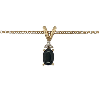 This pre-owned 9ct yellow gold diamond and sapphire pendant necklace is a classic gemstone design, featuring an oval sapphire accented with diamond detailing.

Design: Featuring an oval sapphire with diamond detailing, this pendant combines rich blue tones with warm 9ct yellow gold and is suspended from a 16-inch belcher chain.
Material: Made from 9-carat yellow gold.
Gemstone Detail: Oval sapphire measuring approximately 6mm by 4mm, accented with diamonds.