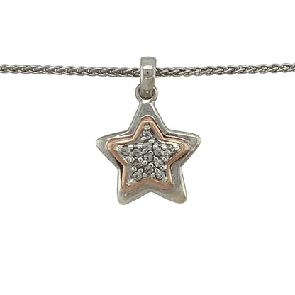 This pre-owned Clogau star pendant necklace is a delicate two-tone design, combining 925 silver with 9ct rose gold and white topaz detailing.

Design: Featuring a star-shaped pendant with contrasting rose gold and white topaz detailing, this Clogau piece is suspended from a 16-inch wheat chain for a classic finish.
Material: Made from 925 silver with 9-carat rose gold detailing.
Gemstone Detail: Set with white topaz.
Pendant Detail: Star pendant measuring approximately 2.1cm long including the bail.