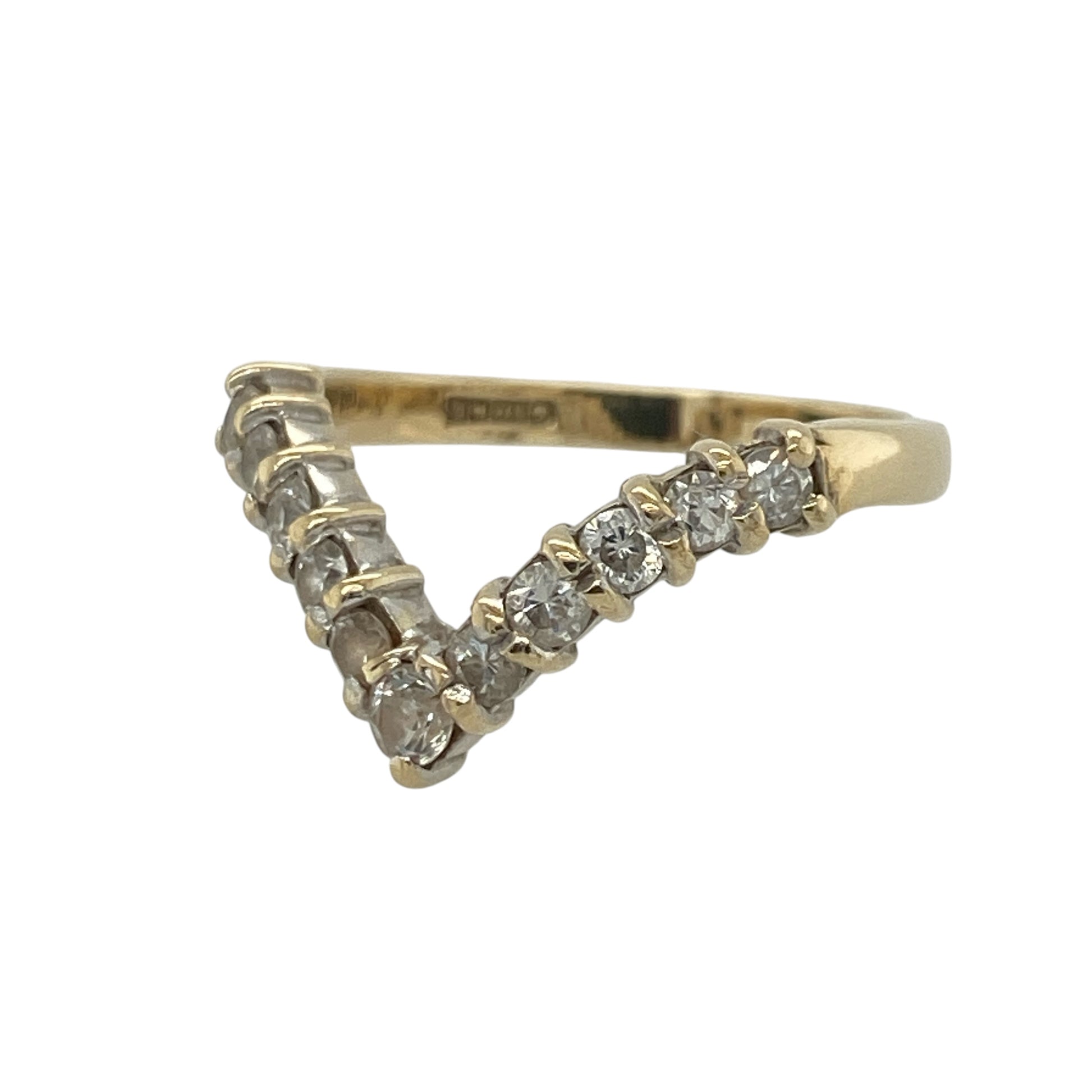 This pre-owned 9ct yellow gold cubic zirconia wishbone ring is a classic curved design, featuring round cubic zirconia stones across the front.

Design: Featuring a traditional wishbone shape set with cubic zirconia stones, this ring combines a curved design with the warm finish of 9ct yellow gold.
Material: Made from 9-carat yellow gold.
Gemstone Detail: Round cubic zirconia stones measuring approximately 3mm in diameter each.
Ring Detail: Cubic zirconia set wishbone design.