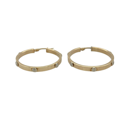 These pre-owned 9ct yellow and white gold screw detail hoop creole earrings are a distinctive two-tone design, featuring decorative screw-style detailing.

Design: Featuring a classic hoop shape with screw detailing, these creole earrings combine yellow and white gold for a contrasting two-tone finish.
Material: Made from 9-carat yellow and white gold.
Earring Detail: Screw detail hoop creoles measuring approximately 29mm in diameter.
Size & Weight: Approximately 29mm in diameter. Total weight 2.40 grams.