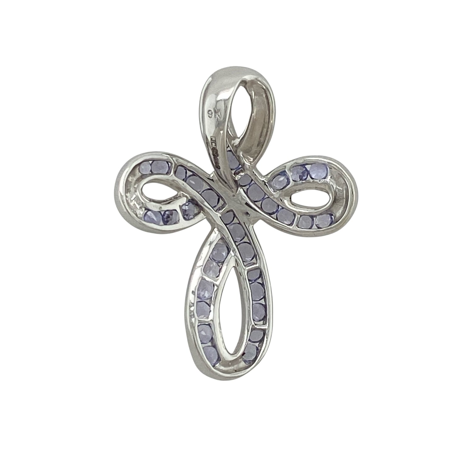 This pre-owned 9ct white gold tanzanite cross pendant is a distinctive design, featuring a loop-style cross set with tanzanite stones.

Design: Featuring a loop-style cross design with tanzanite detailing, this pendant has an elegant flowing shape finished in 9ct white gold.
Material: Made from 9-carat white gold.
Gemstone Detail: Set with tanzanite stones.
Pendant Detail: Loop-style cross pendant with a bail measuring approximately 8mm by 3mm.
Size & Weight: Total weight 4.60 grams.