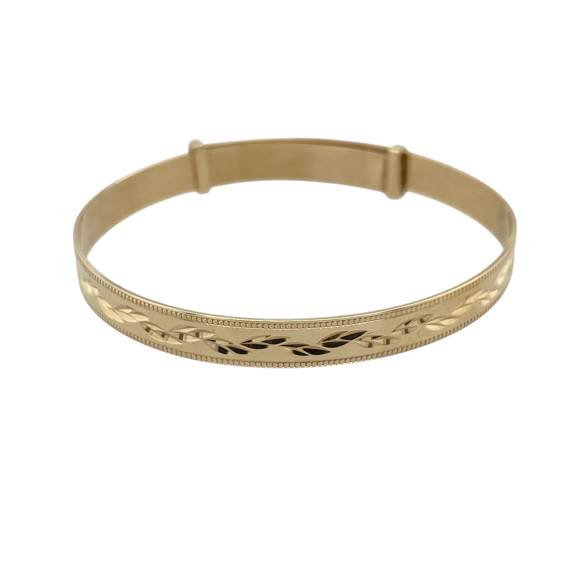 This pre-owned 9ct yellow gold children's bangle is a traditional expanding design, featuring decorative patterned detailing.

Design: Featuring a patterned finish with an expanding design, this children's bangle can be adjusted from approximately 4.5cm to 5cm in diameter.
Material: Made from 9-carat yellow gold.
Bangle Detail: Band measures approximately 5mm wide with an expanding design.
Size & Weight: Approximately 4.5cm in diameter when closed and 5cm when fully expanded. Total weight 4.20 grams.