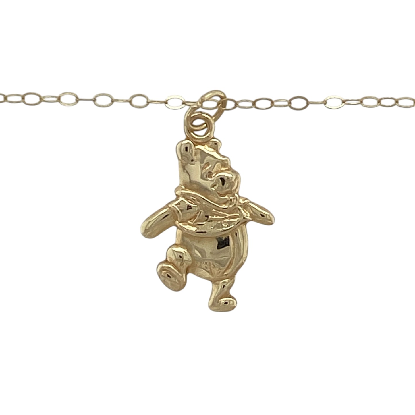 This pre-owned 9ct yellow gold Winnie the Pooh pendant necklace is a charming character design, suspended from a fine trace chain.

Design: Featuring a Winnie the Pooh character pendant, this playful piece is finished in warm 9ct yellow gold and suspended from an 18-inch trace chain.
Material: Made from 9-carat yellow gold.
Pendant Detail: Winnie the Pooh pendant measuring approximately 2.1cm long including the bail.
Size & Weight: Approximately 18 inches long. Total weight 0.70 grams.