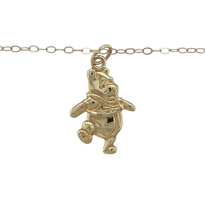 This pre-owned 9ct yellow gold Winnie the Pooh pendant necklace is a charming character design, suspended from a fine trace chain.

Design: Featuring a Winnie the Pooh character pendant, this playful piece is finished in warm 9ct yellow gold and suspended from an 18-inch trace chain.
Material: Made from 9-carat yellow gold.
Pendant Detail: Winnie the Pooh pendant measuring approximately 2.1cm long including the bail.
Size & Weight: Approximately 18 inches long. Total weight 0.70 grams.