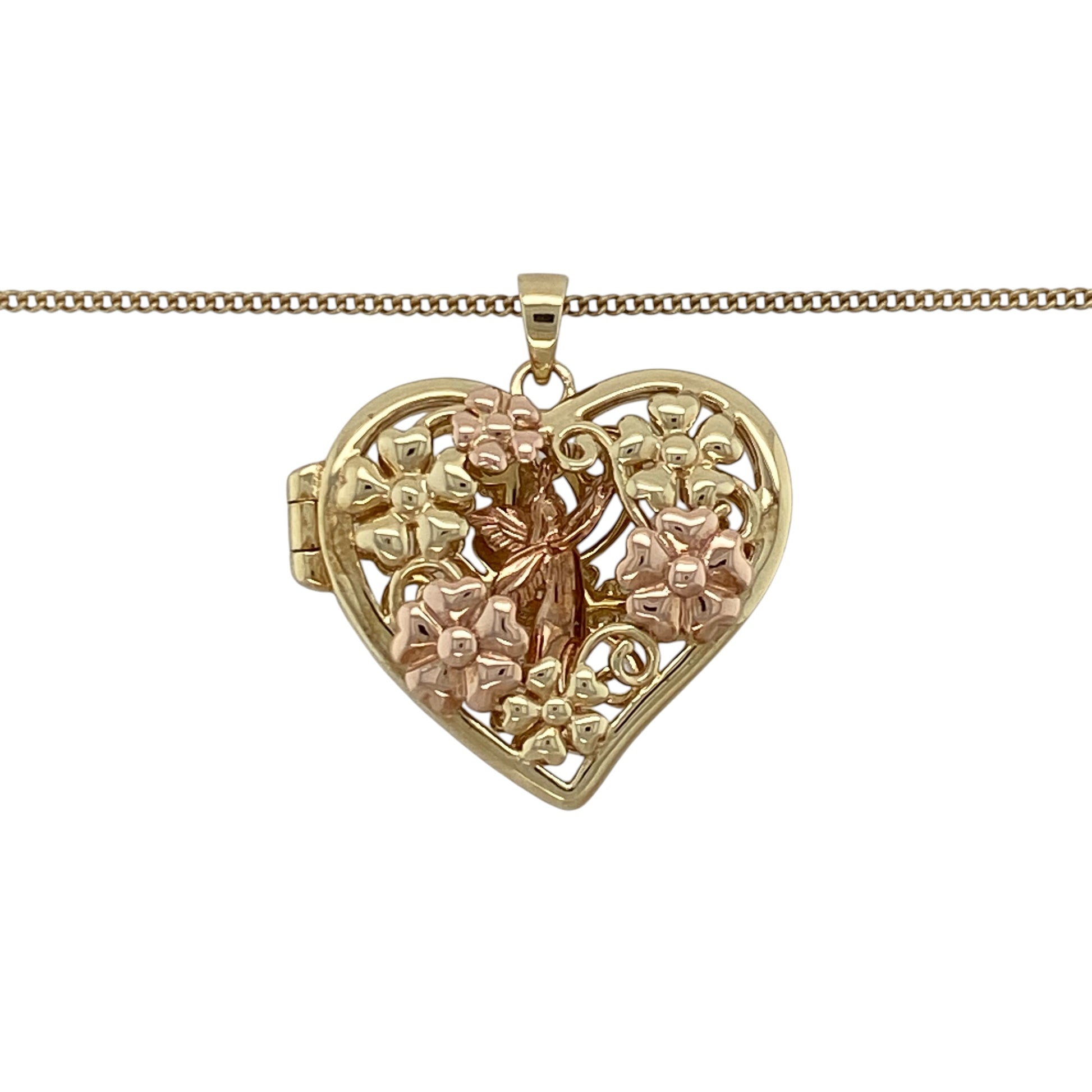 This pre-owned Clogau heart-shaped locket necklace is a distinctive two-tone design, featuring a fairy motif with decorative floral detailing.

Design: Featuring a heart-shaped locket with a fairy inside and flower-patterned detailing around the design, this Clogau piece combines yellow and rose gold and is suspended from an adjustable curb chain.
Material: Made from 9-carat yellow and rose gold.
Pendant Detail: Heart-shaped locket measuring approximately 2.5cm long including the bail.