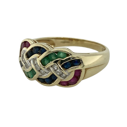 This pre-owned 9ct yellow gold diamond, emerald, ruby and sapphire plaited band ring is a colourful design, combining multiple gemstones within an interwoven style.

Design: Featuring a plaited band design set with diamonds, emeralds, rubies and sapphires, this ring combines a distinctive woven appearance with the warm finish of 9ct yellow gold.
Material: Made from 9-carat yellow gold.
Gemstone Detail: Set with diamonds, emeralds, rubies and sapphires.